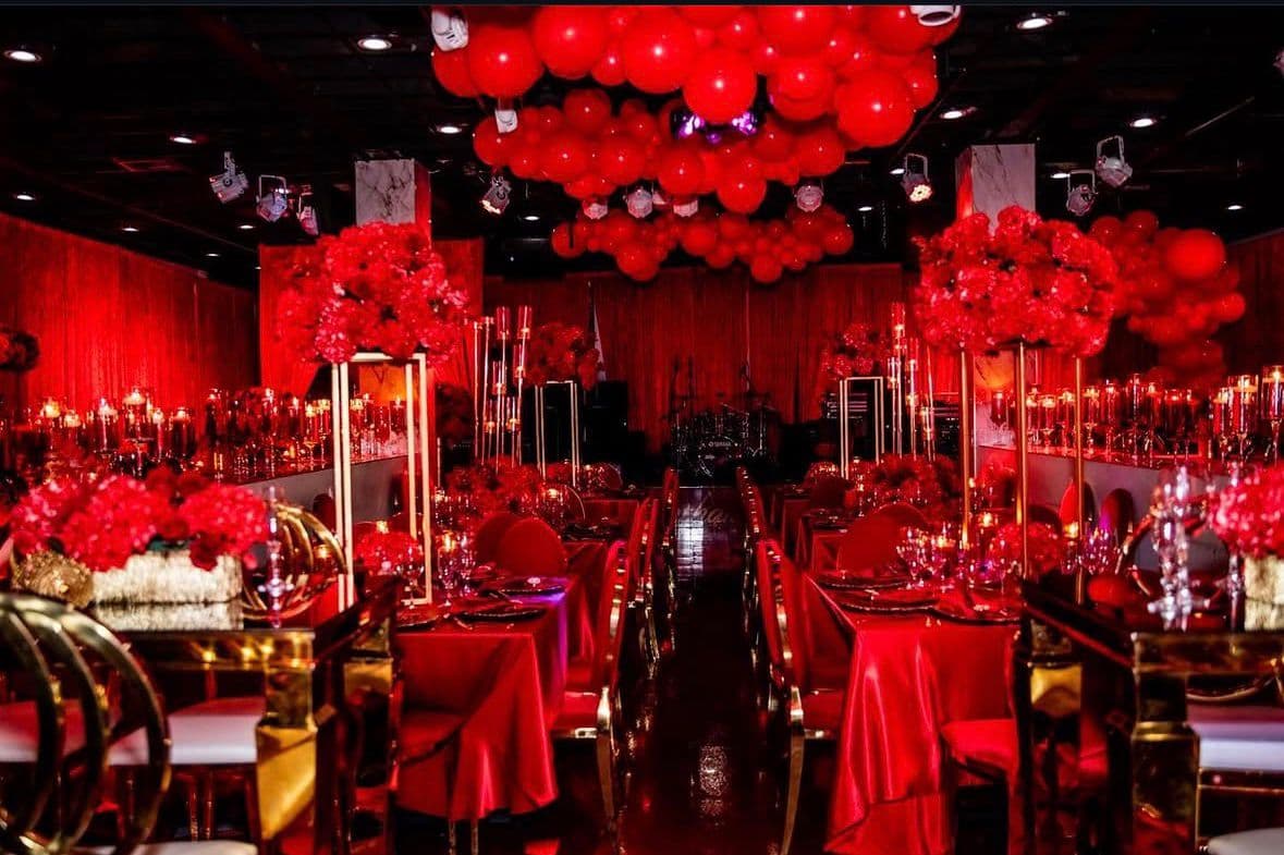 Elegant red event setup at Pearl of the Island Venue